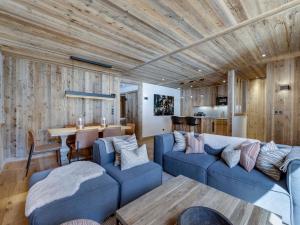 a living room with blue couches and a wooden ceiling at Appartement Val-d'Isère, 4 pièces, 6 personnes - FR-1-694-40 in Val-d'Isère