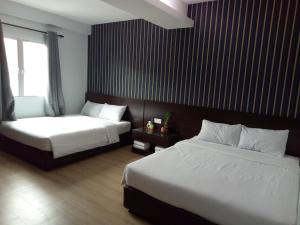 Postel nebo postele na pokoji v ubytování 7 Hotel