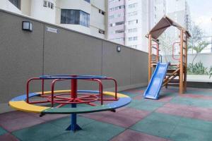 a playground with a slide and a slideintend at Apto com 2 suítes Próx. Hospital Unique/Vaca Brava in Goiânia