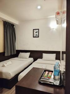 Postel nebo postele na pokoji v ubytování 7 Hotel
