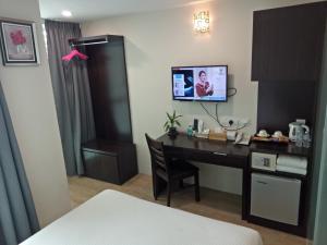 TV a/nebo společenská místnost v ubytování 7 Hotel
