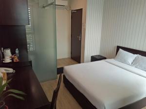 Postel nebo postele na pokoji v ubytování 7 Hotel