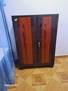 a wooden cabinet sitting on top of a wooden floor at Sky Villa Weligama in Weligama