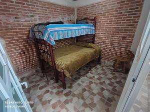 Divstāvu gulta vai divstāvu gultas numurā naktsmītnē Hiker's Home - Hostel Inn