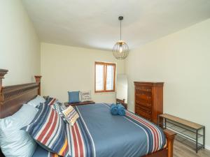 a bedroom with a bed and a dresser at Villa Pero & Jele in Mlini