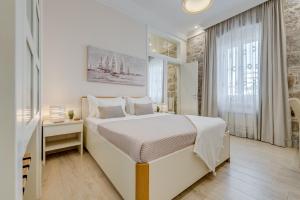 מיטה או מיטות בחדר ב-Victoria Luxury Rooms - Split Downtown