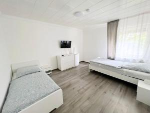 Ένα ή περισσότερα κρεβάτια σε δωμάτιο στο Work & Stay in Siegburg