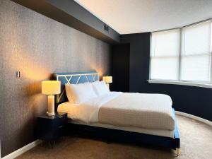a bedroom with a large bed and a window at Cityscape in the heart of Ballston in Arlington