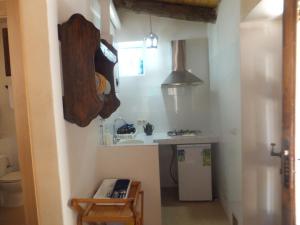 a small kitchen with a sink and a counter at Río Mundo Alojamiento Rural in Riópar