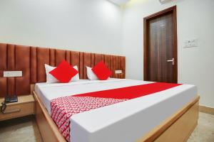 Voodi või voodid majutusasutuse OYO Flagship Dhruva Residency toas