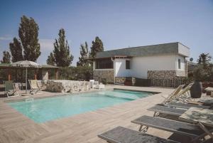 The swimming pool at or close to L'ANFORA DELLE MURELLE