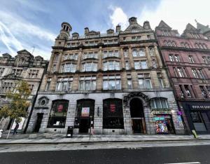 a large building on the side of a street at Modern Studio Apartment by BOLD Apartments in Liverpool