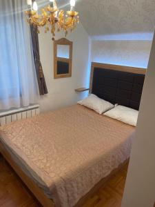 Postel nebo postele na pokoji v ubytování LUX Apartman Hedonic