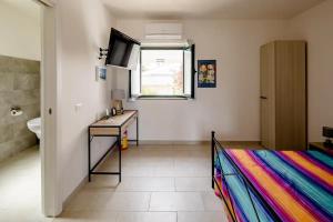 A bed or beds in a room at L'ANFORA DELLE MURELLE