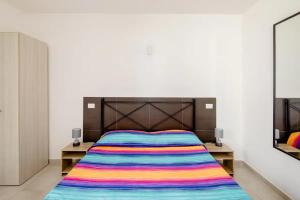A bed or beds in a room at L'ANFORA DELLE MURELLE