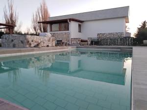 The swimming pool at or close to L'ANFORA DELLE MURELLE
