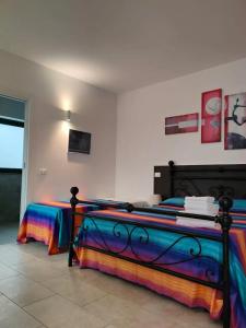 A bed or beds in a room at L'ANFORA DELLE MURELLE