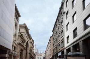 Nespecifikovaný výhled na destinaci Milán nebo výhled na město při pohledu z apartmánu