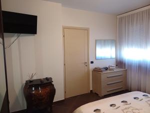 A bed or beds in a room at NSM Casa di Fulmine attico con box privato