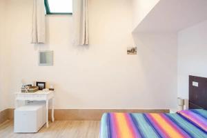 A bed or beds in a room at L'ANFORA DELLE MURELLE