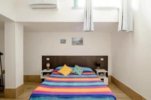 A bed or beds in a room at L'ANFORA DELLE MURELLE