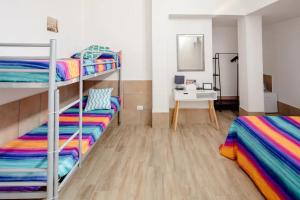 A bed or beds in a room at L'ANFORA DELLE MURELLE