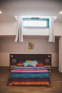 A bed or beds in a room at L'ANFORA DELLE MURELLE