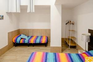 Ένα ή περισσότερα κρεβάτια σε δωμάτιο στο L'ANFORA DELLE MURELLE