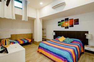 A bed or beds in a room at L'ANFORA DELLE MURELLE