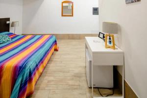A bed or beds in a room at L'ANFORA DELLE MURELLE