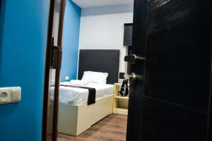 Ένα ή περισσότερα κρεβάτια σε δωμάτιο στο Elysium Gallery Hotel
