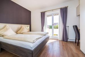 Łóżko lub łóżka w pokoju w obiekcie Villa Dalmatina Zadar mit Pool
