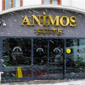 a store front in the snow with a sign on it at ANİMOS BUTİK OTEL in Ankara