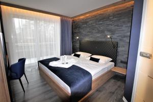 Postel nebo postele na pokoji v ubytování Privat & Boutique Hotel Plauer See