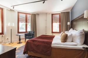 Postel nebo postele na pokoji v ubytování Home Hotel Kung Oscar