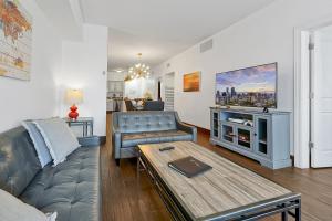 a living room with a couch and a table at International Drive Luxury Condo in Orlando