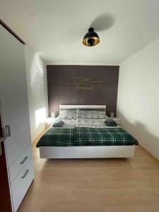 Postel nebo postele na pokoji v ubytování Mühlbacher Lodge, ski Amadé