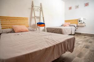 a room with two beds and a ladder at EL MIRADOR in Jaén +17 photos