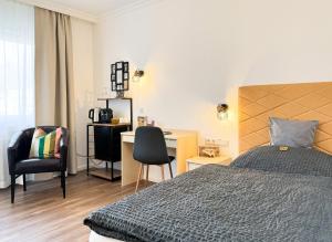 Ein Bett oder Betten in einem Zimmer der Unterkunft AhrPart Hotel Central