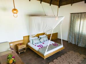 Кровать или кровати в номере Turkuaz Beach Zanzibar