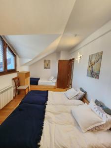 a bedroom with two beds in a room at One Bedroom Apartment Pirin Lodge in Bansko