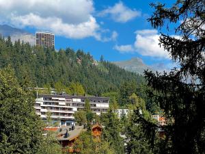 a large building in the middle of a mountain at Supercrans, Rte de la Tour 10, Superb View!! in Crans-Montana