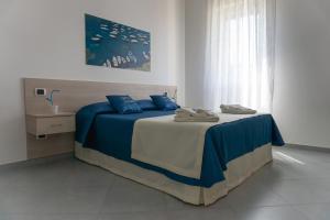 Voodi või voodid majutusasutuse Agriturismo Le Radici toas