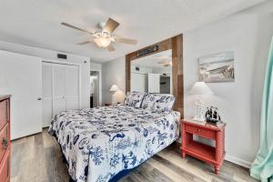 a bedroom with a bed and a ceiling fan at Phoenix 1093 in Orange Beach +32 photos