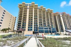 a large building on the beach in front of aominium at Phoenix 1093 in Orange Beach