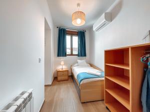 a small bedroom with a bed and a window at Fee4Me La Azotea de Morata in Morata de Tajuña