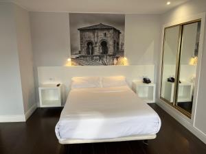 Postel nebo postele na pokoji v ubytování Hotel Gran Regente