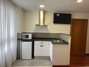 Kuchyň nebo kuchyňský kout v ubytování Hotel Gran Regente