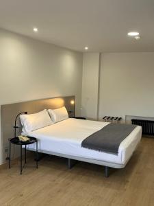 Postel nebo postele na pokoji v ubytování Hotel Gran Regente