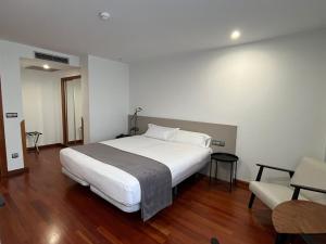 Postel nebo postele na pokoji v ubytování Hotel Gran Regente